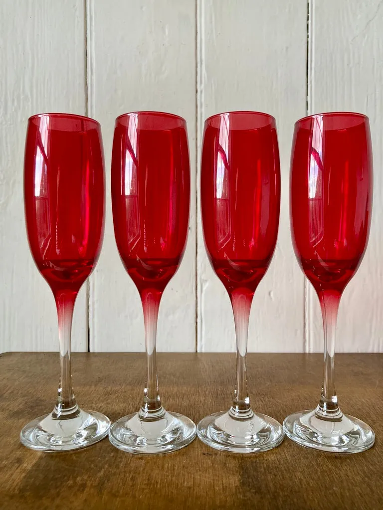 A set of 4 vintage cranberry glass champagne flutes